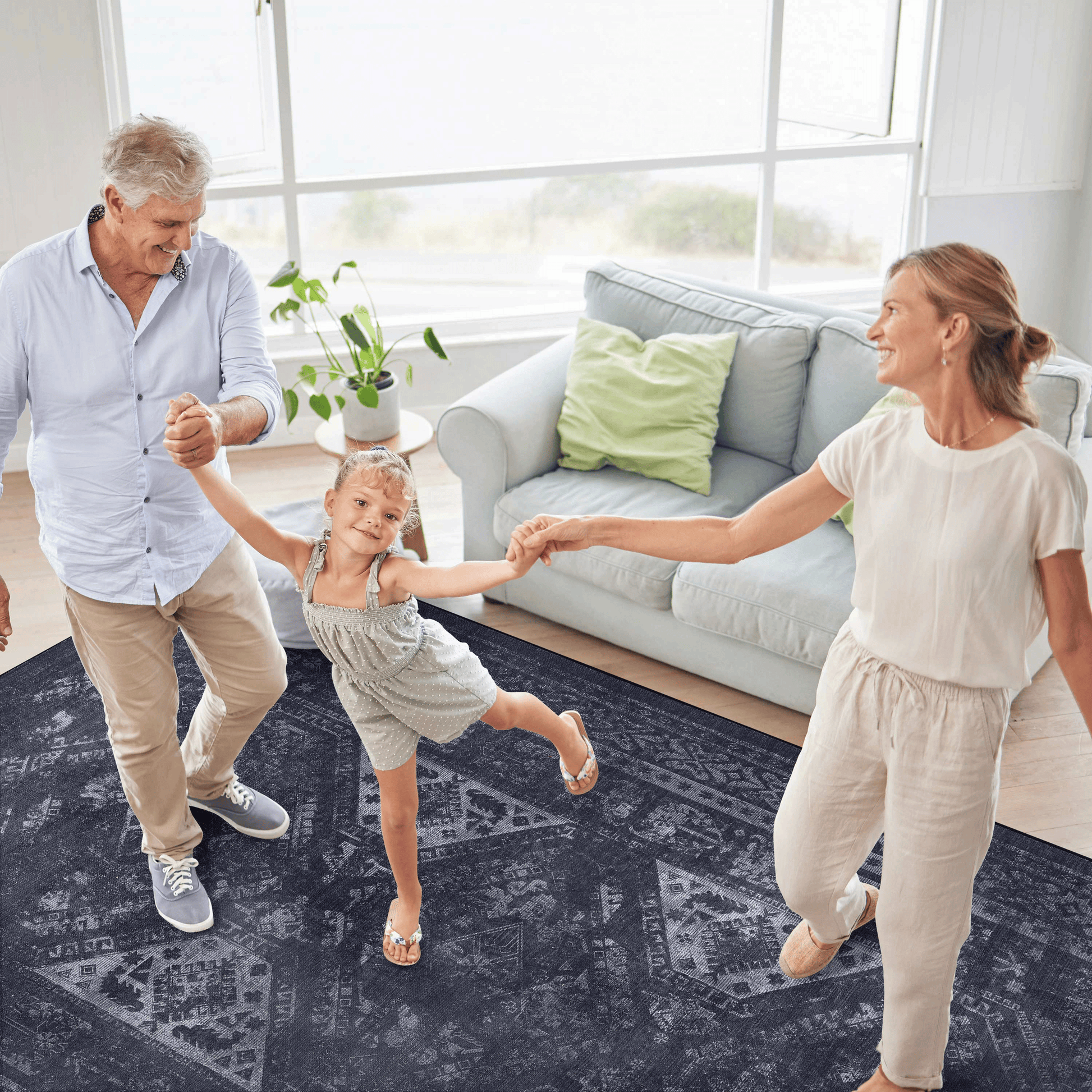Dark gray area rug with intricate geometric patterns ideal for living rooms