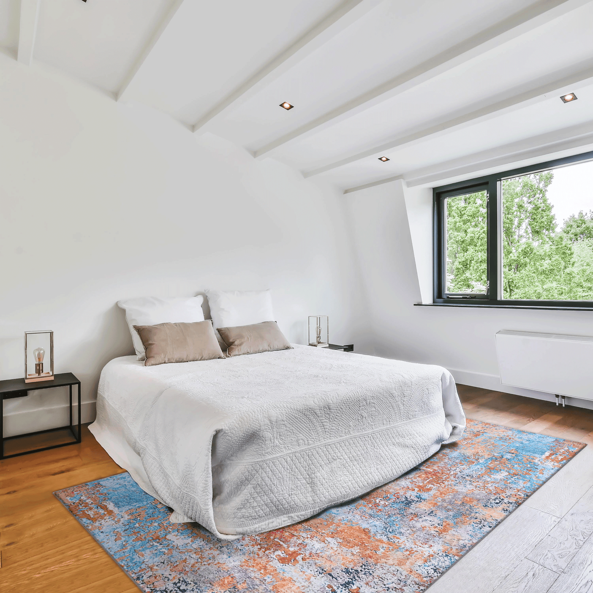 Plush white quilted duvet with textured pattern layered with taupe accent pillows on a kingsize bed
