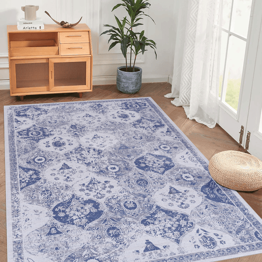 Blue and white distressed medallion rug with intricate floral patterns