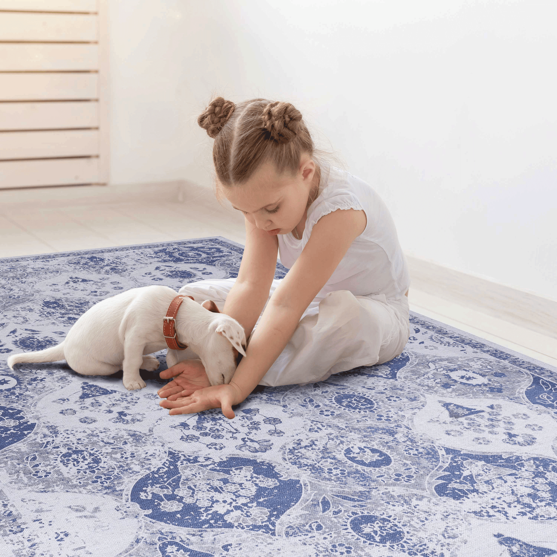Blue and white distressed oriental rug with intricate floral and paisley patterns perfect for living room