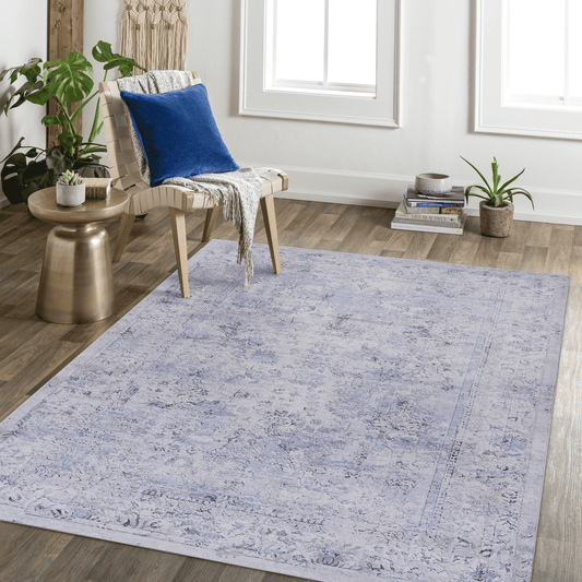 Pale blue traditional distressed Persian rug with intricate floral patterns and a detailed border