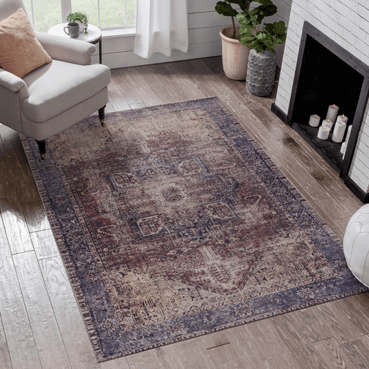 Distressed Persianstyle area rug with intricate blue and burgundy patterns