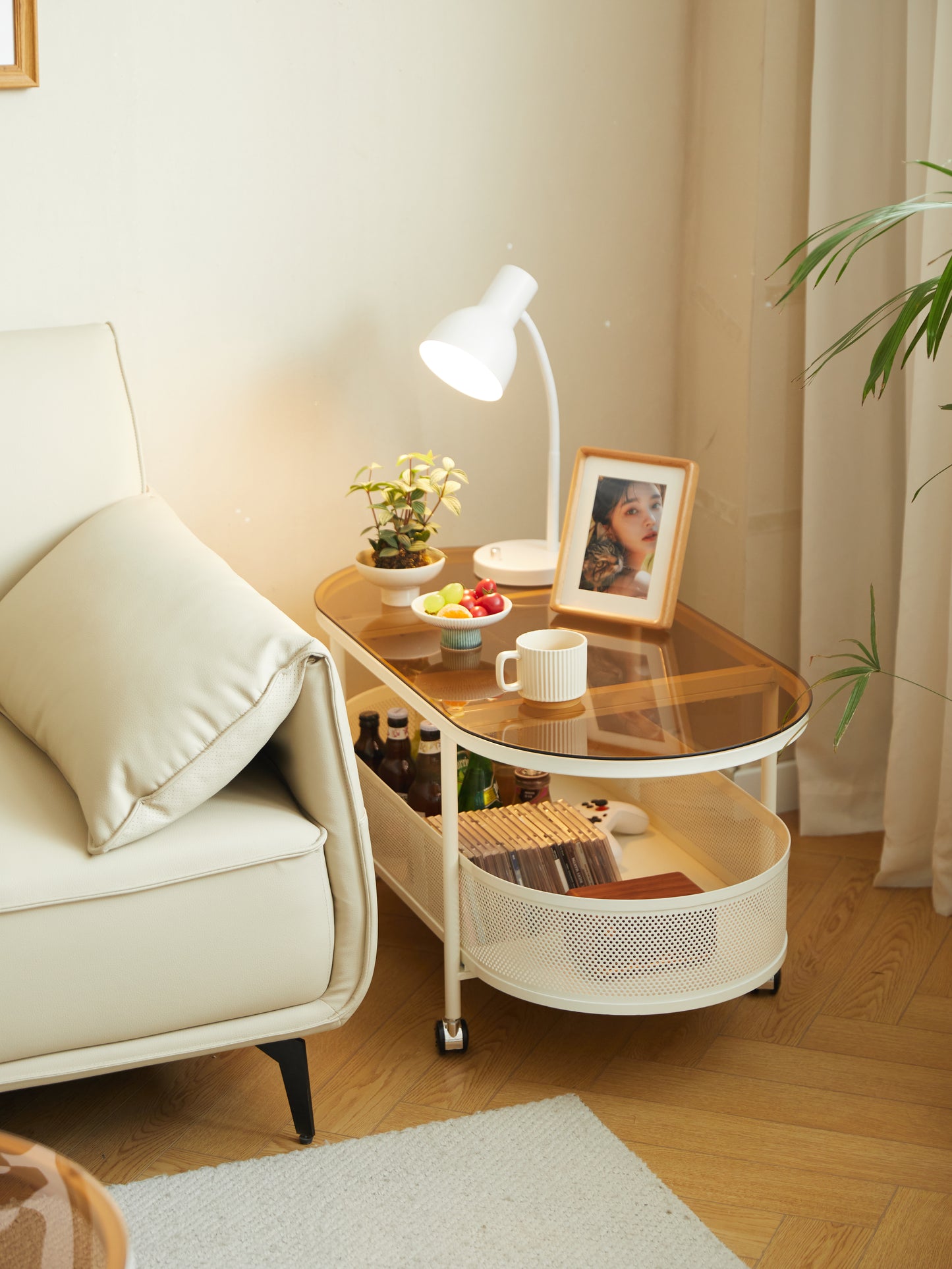 Modern rolling side table with tempered glass top and lower storage shelf
