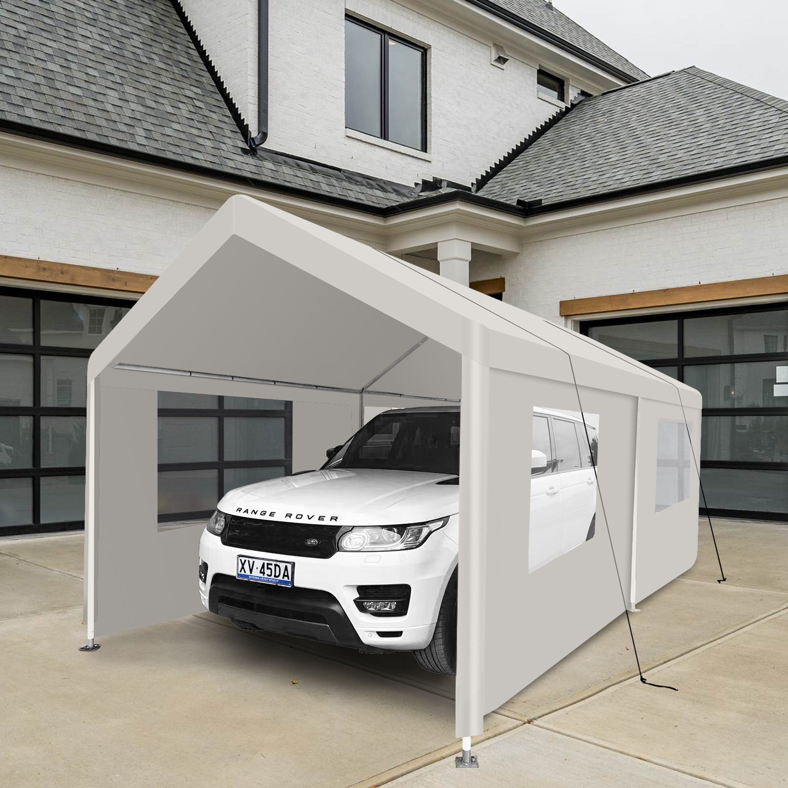 White portable carport protecting a white SUV from the elements