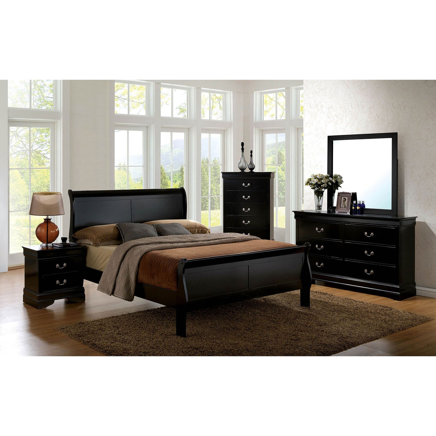 Black sleigh bed with matching nightstand and dresser