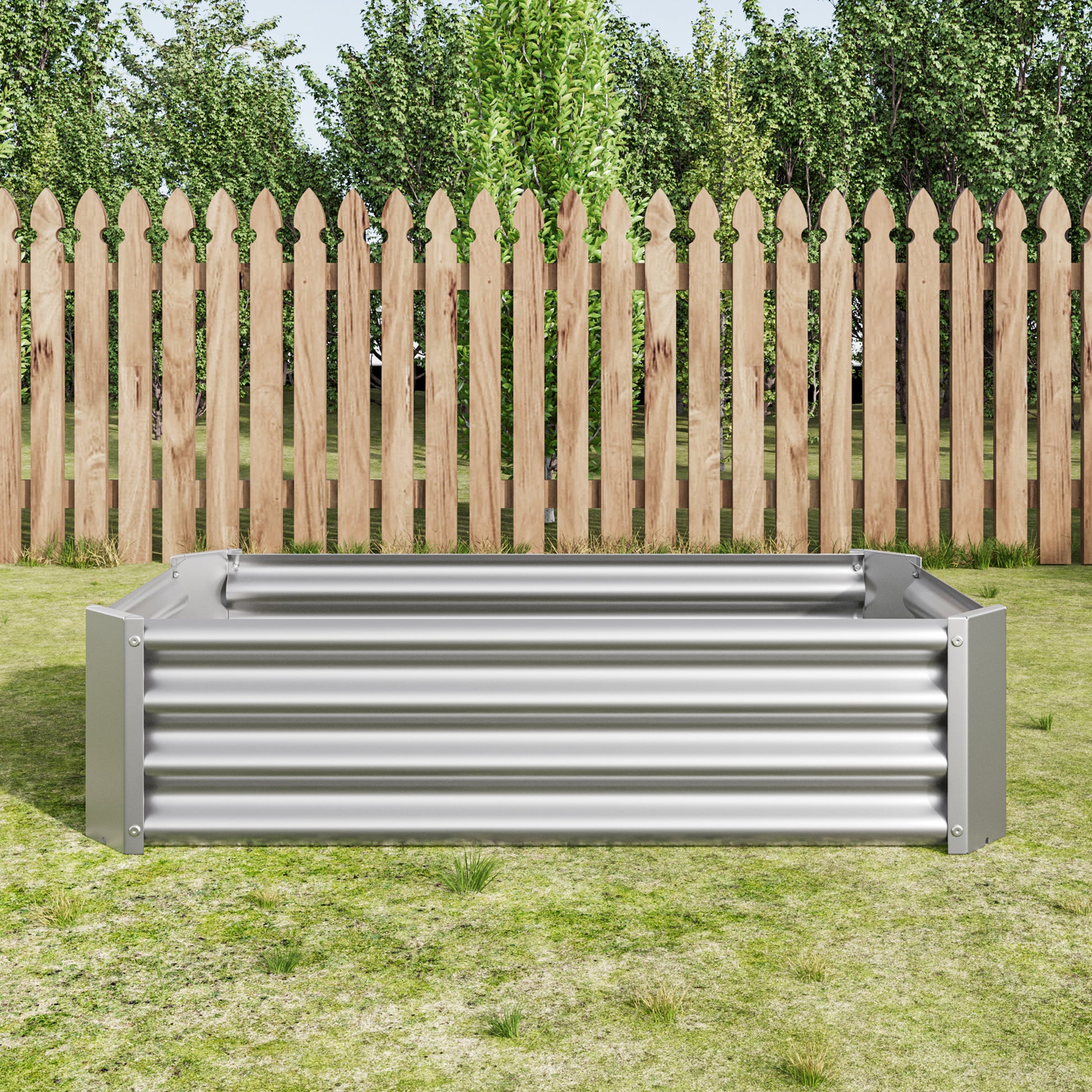 Silver metal corrugated raised garden bed on grass with wooden fence background