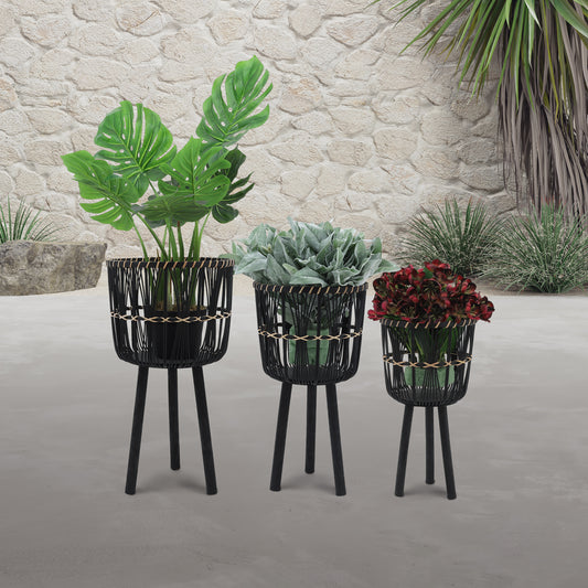 Black woven planter stand with Monstera plant modern outdoor decor