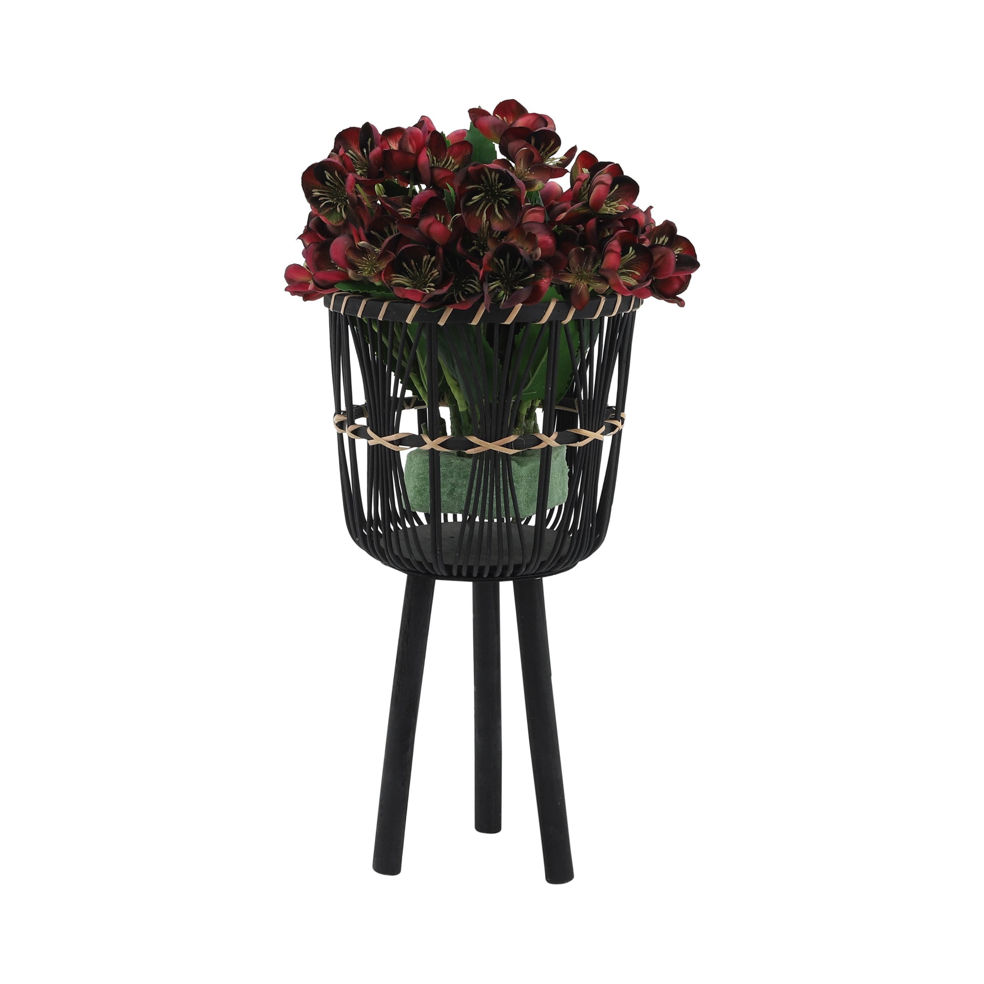 Dark red faux flowers in a black woven planter with three legs ideal for modern decor
