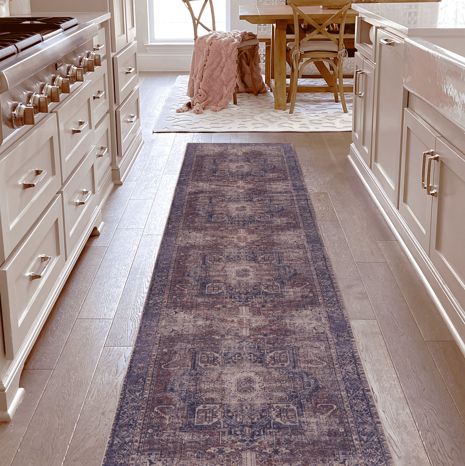 Distressed vintage runner rug with purple rust and cream intricate patterns