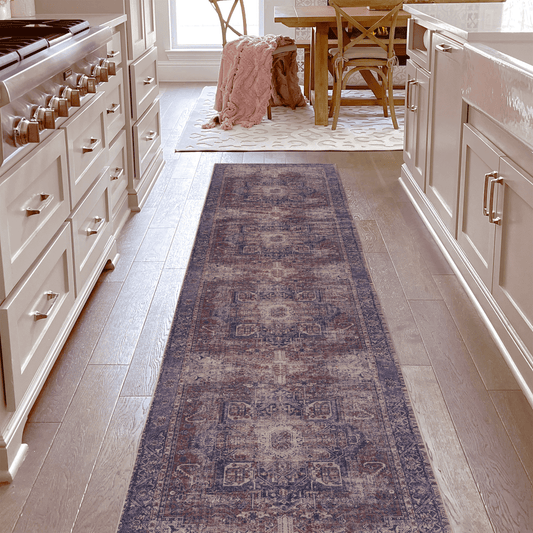 Distressed vintage runner rug with purple rust and cream intricate patterns