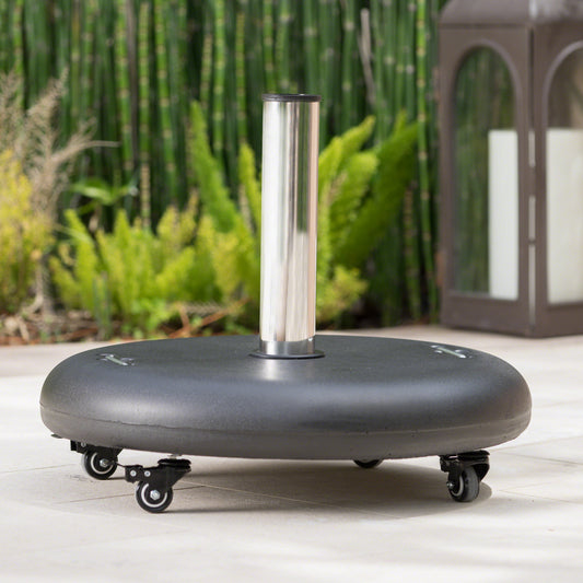 Black patio umbrella base with wheels for easy portability and stability