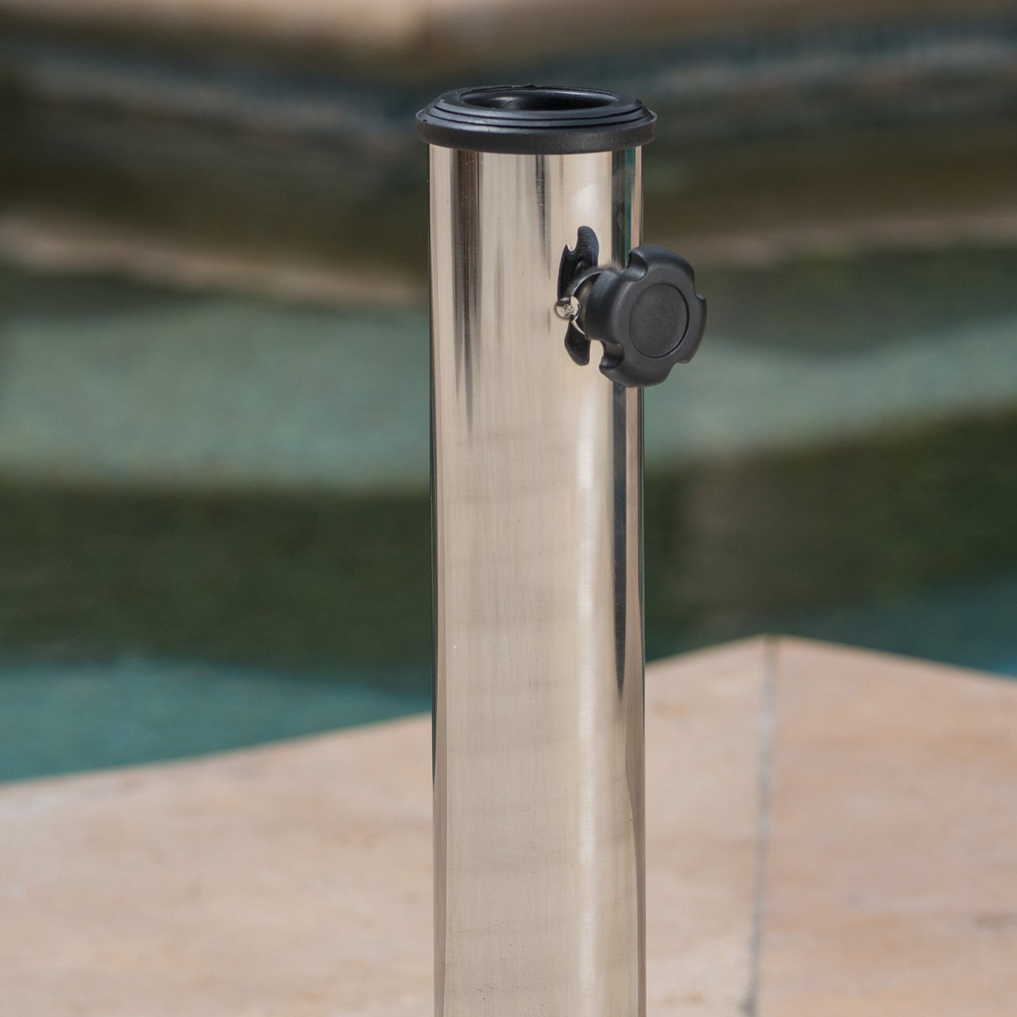Polished stainless steel umbrella stand with black knob for patio use