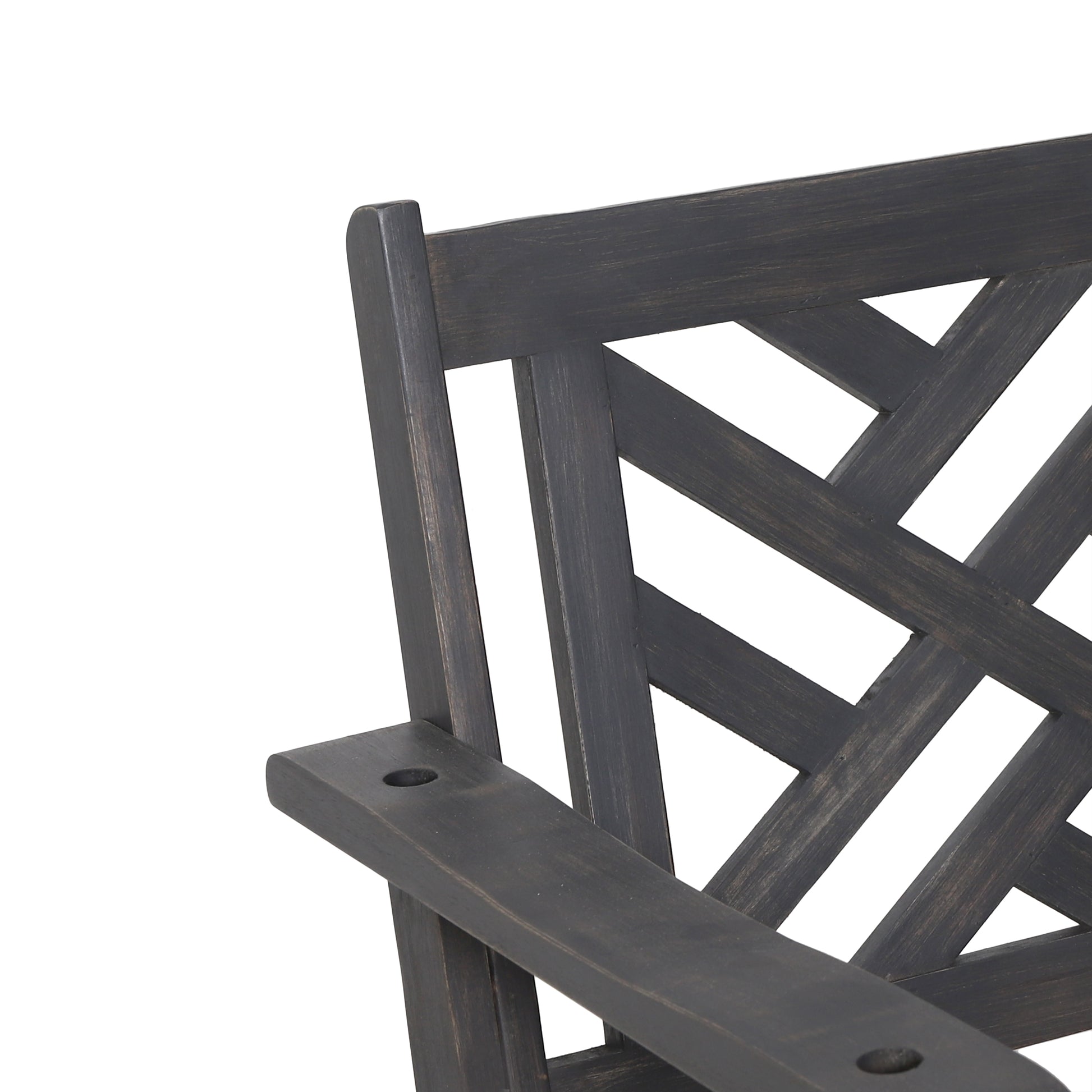 Closeup of dark brown wooden garden bench armrest and lattice back detail