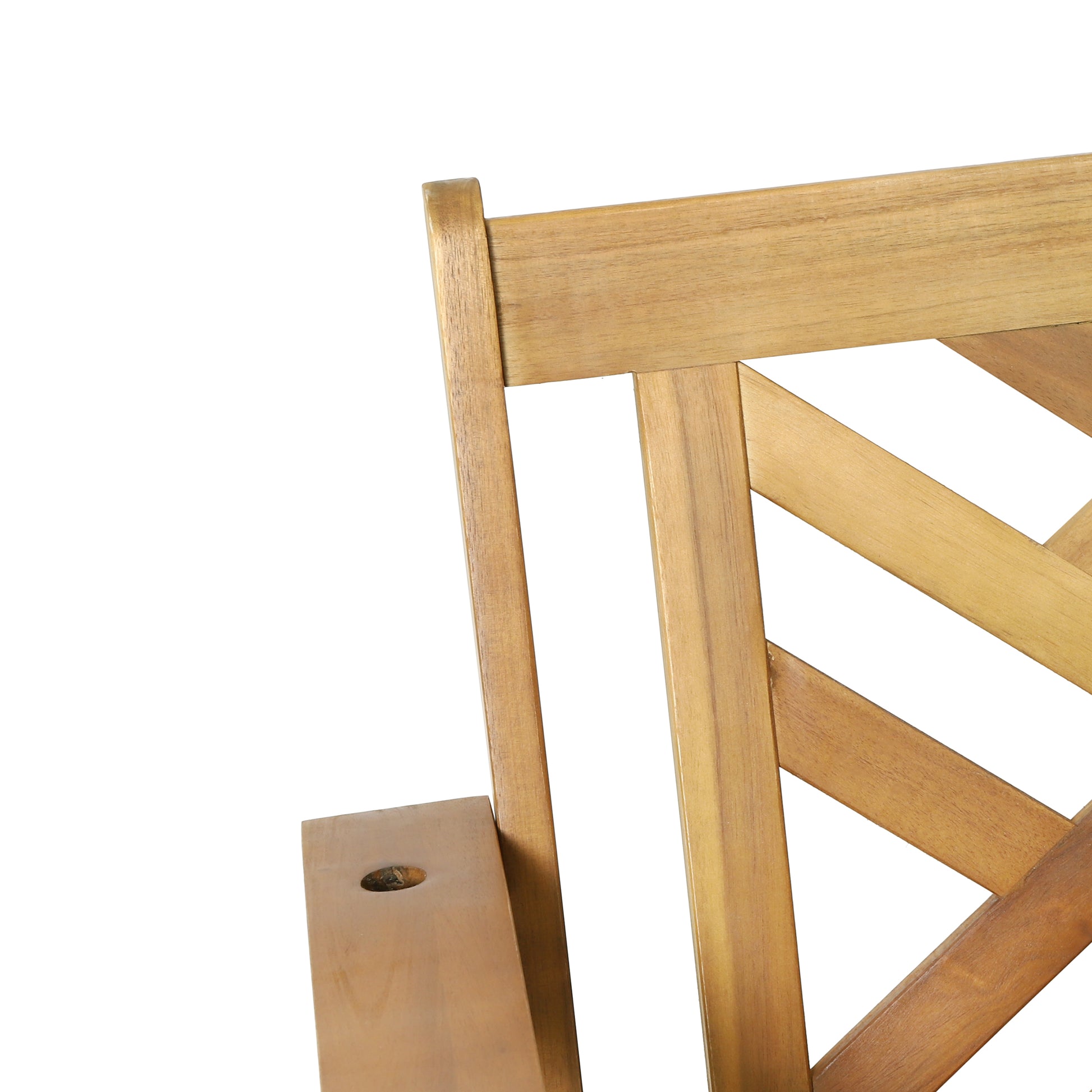 Detail of a natural wood outdoor chair armrest with a subtle knot detail