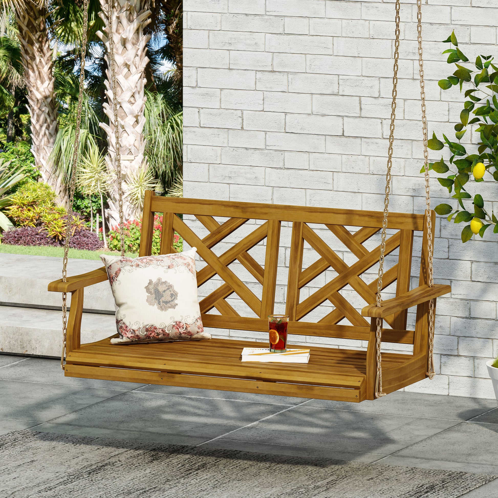 A wooden patio swing bench with a decorative backrest comfortable for outdoor relaxation