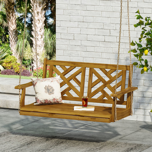 A wooden patio swing bench with a decorative backrest comfortable for outdoor relaxation