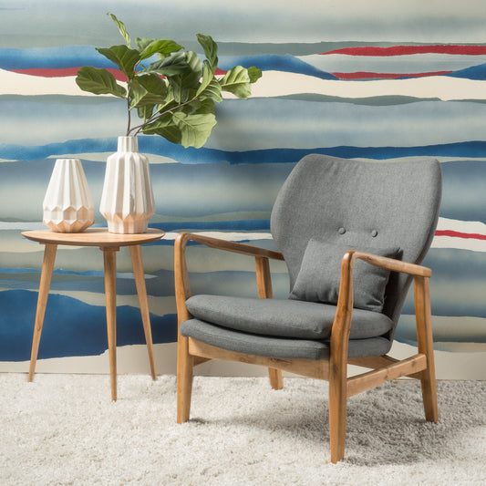 Gray fabric accent chair with wooden frame and decorative pillows