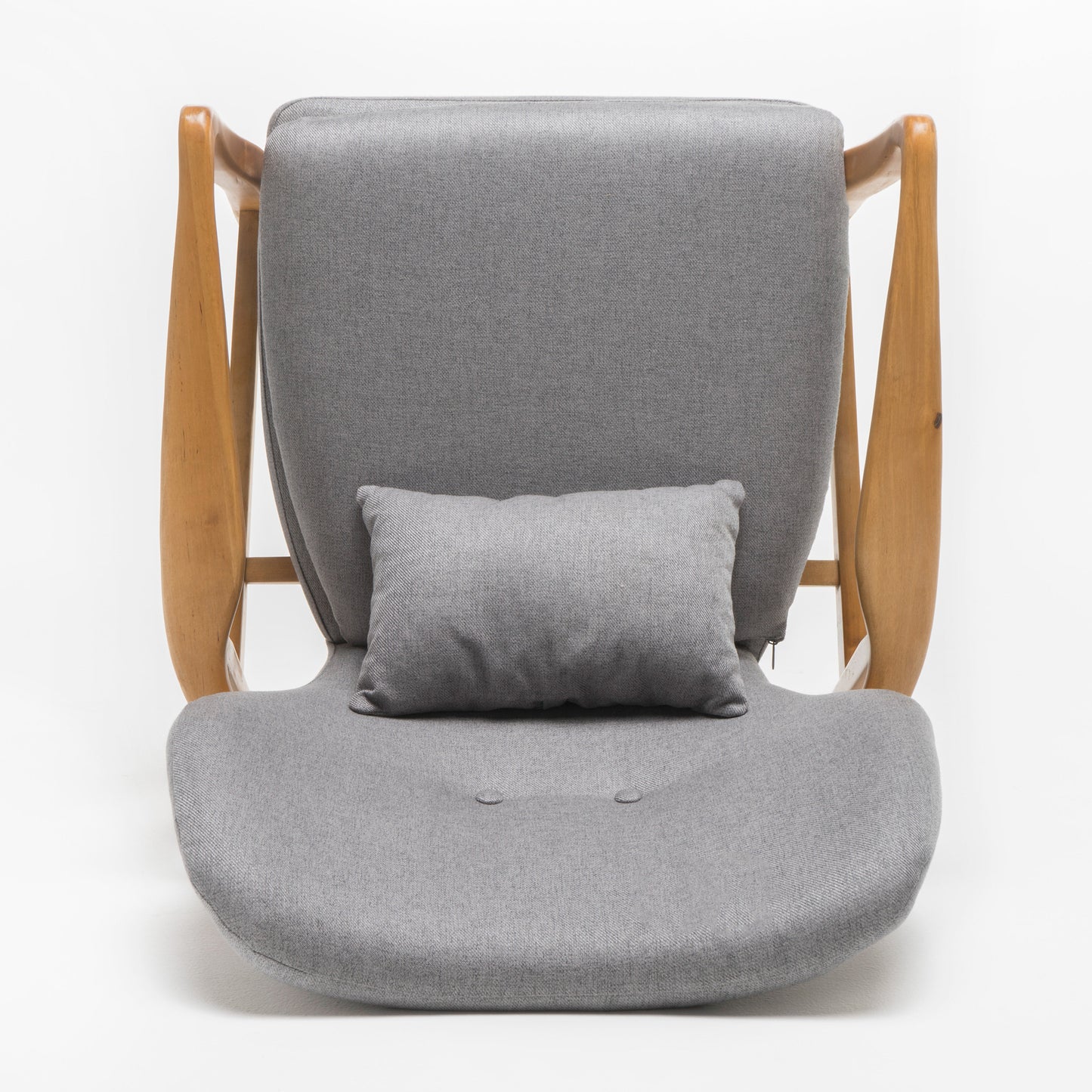 Midcentury modern armchair in grey fabric with curved wooden frame and lumbar pillow
