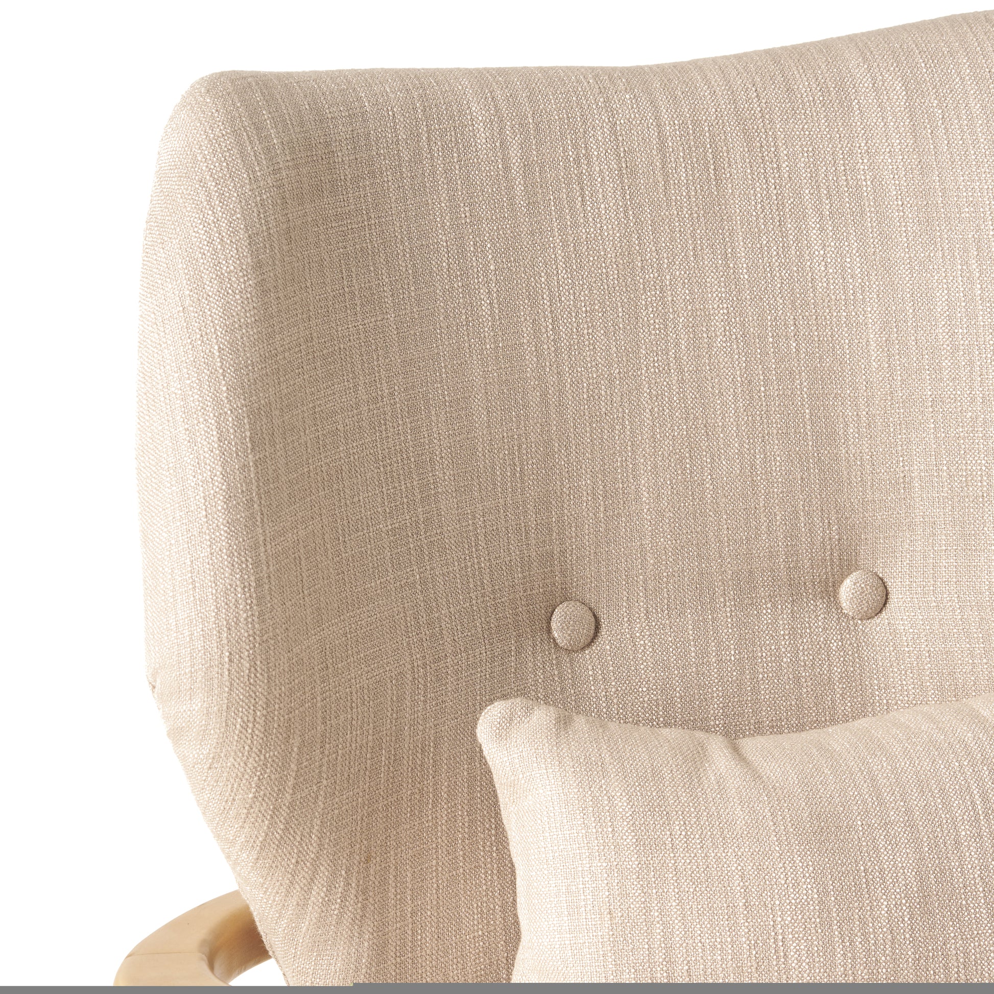 Beige linen armchair with tufted button detailing and a matching lumbar pillow
