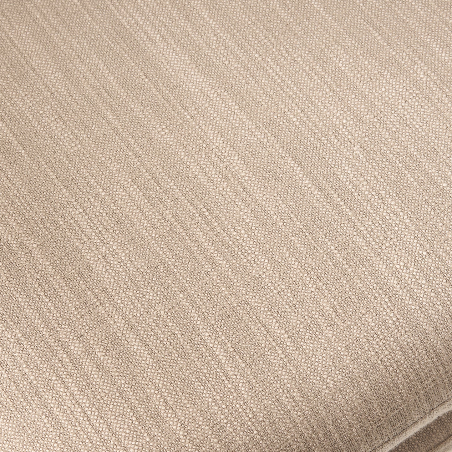 Closeup of textured beige linen fabric with visible weave detail
