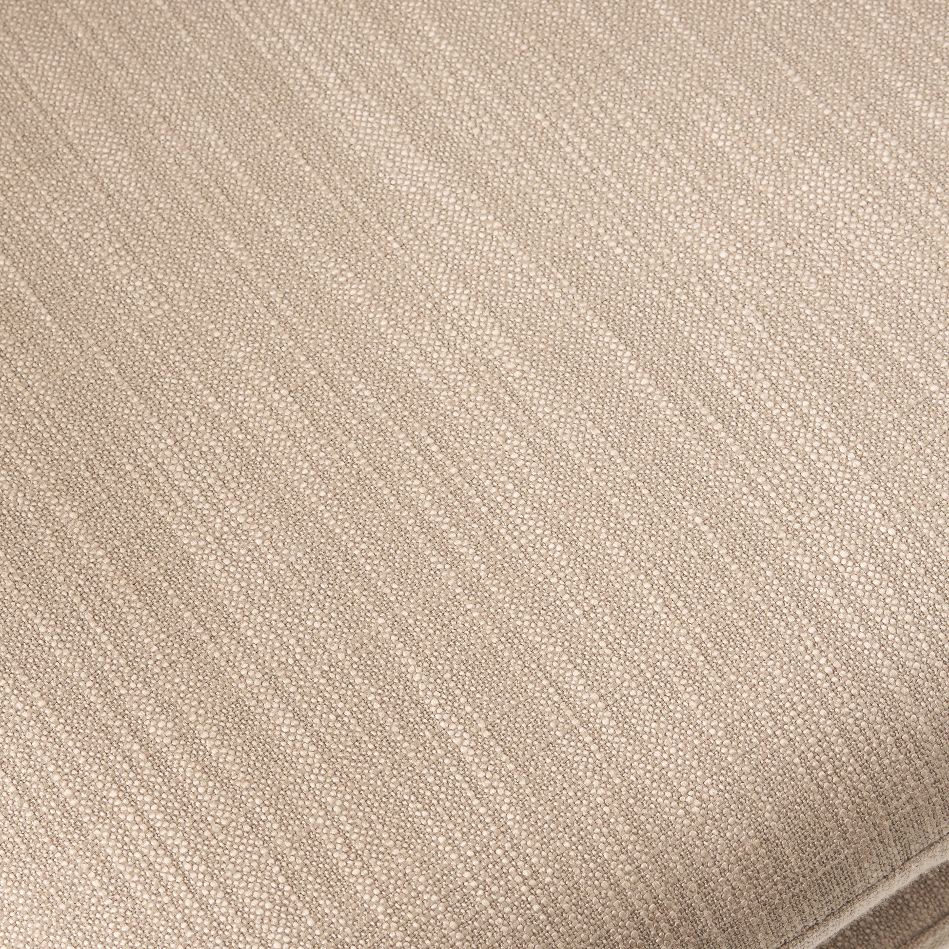 Closeup of textured beige linen fabric with visible weave detail
