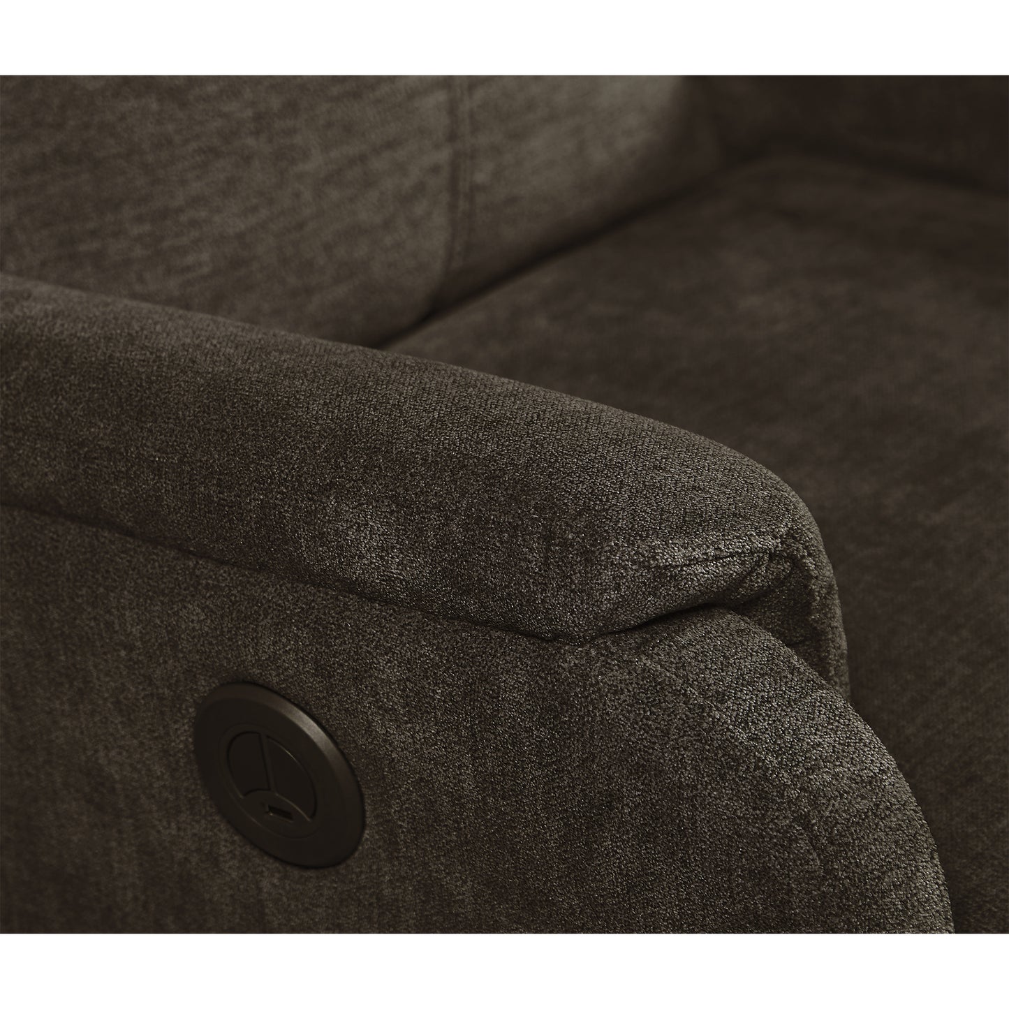 Closeup of a dark gray fabric recliner armrest with a power button detail for comfortable seating