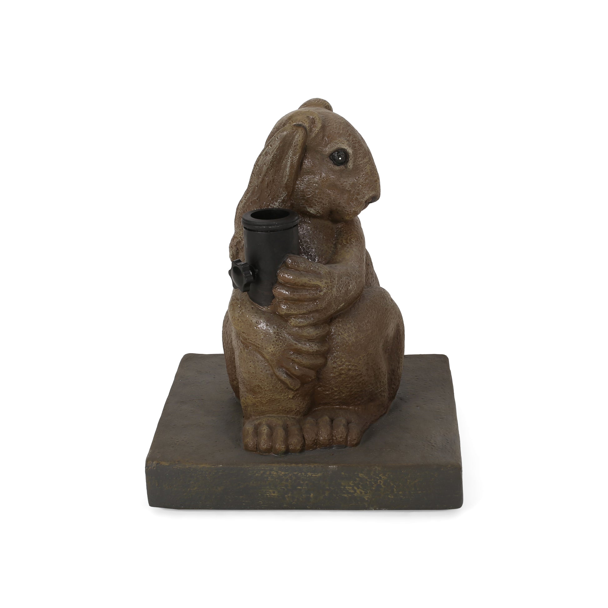 Bronze rabbit statue holding a black cylindrical object on a dark base