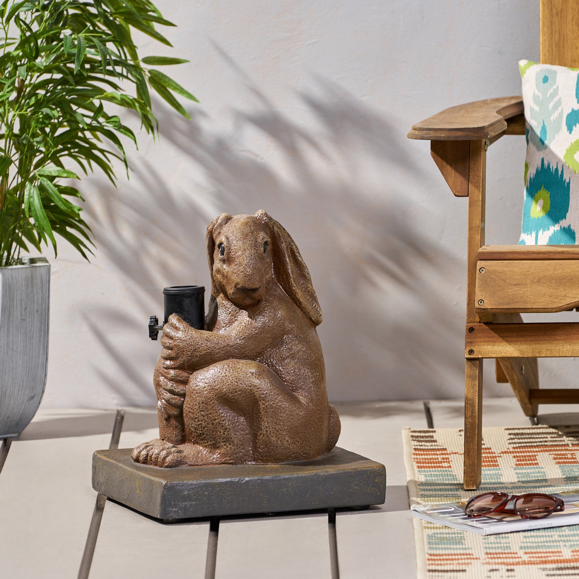 Brown resin bunny garden statue holding umbrella stand securely