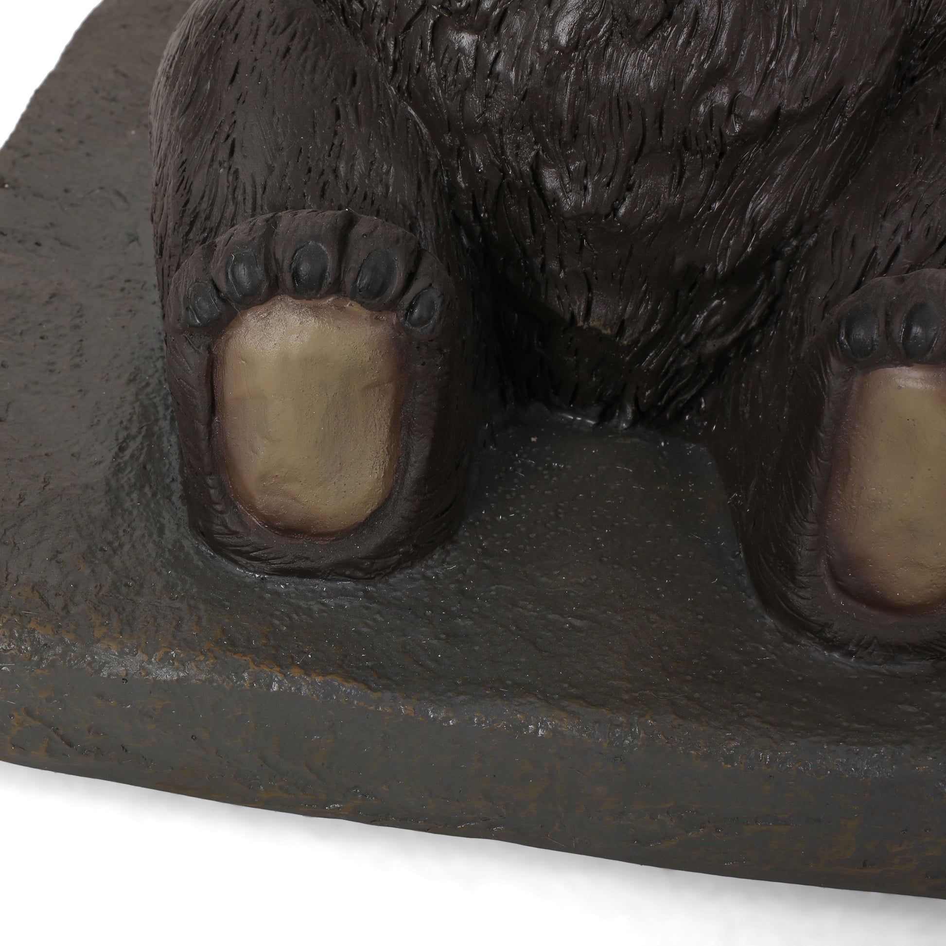 Realistic brown bear figurine paws on a textured base perfect for wildlife decor