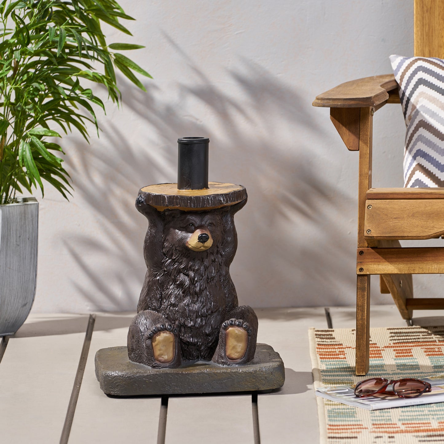 Brown bear resin statue holding a wooden log with a black cylindrical holder garden decor