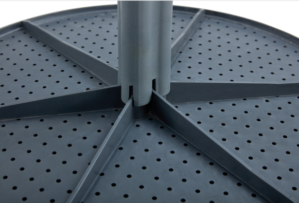 Dark grey plastic rotating tray with perforated surface and central pole mount