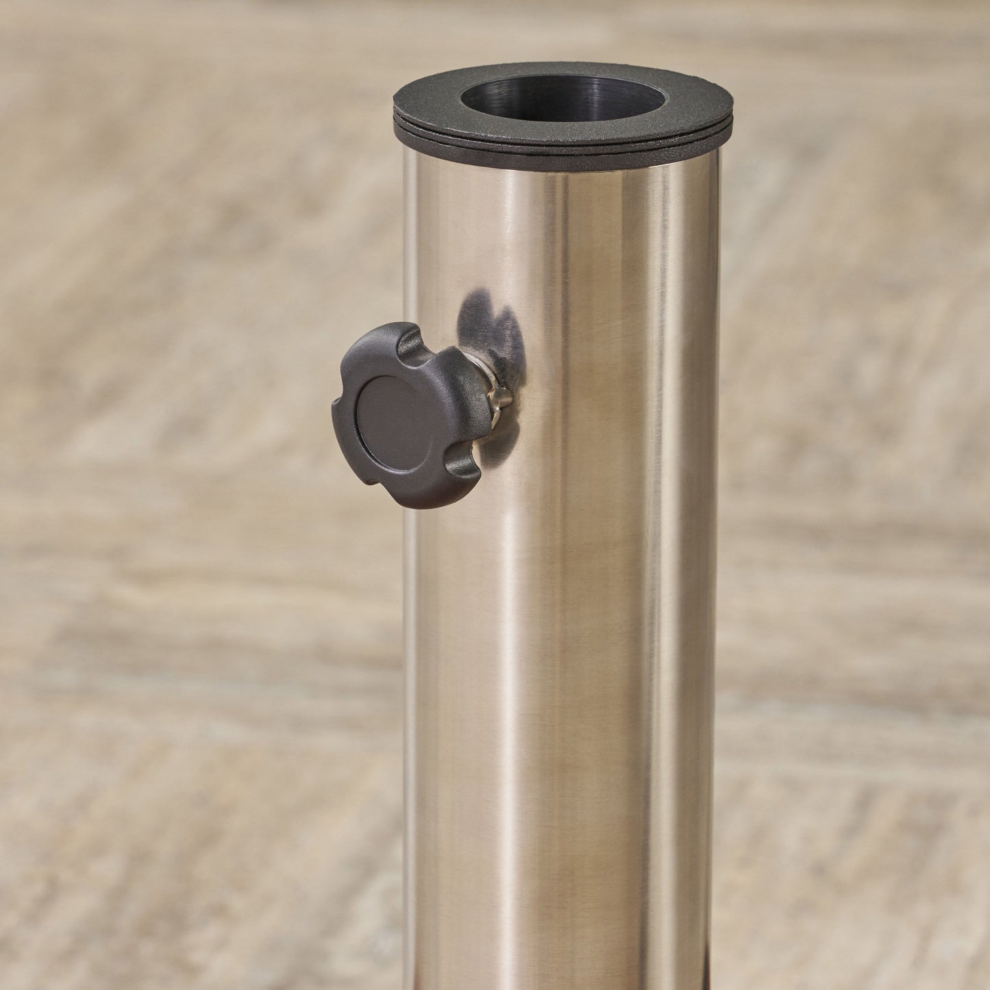 Brushed stainless steel patio umbrella stand base with black tightening knob and collar