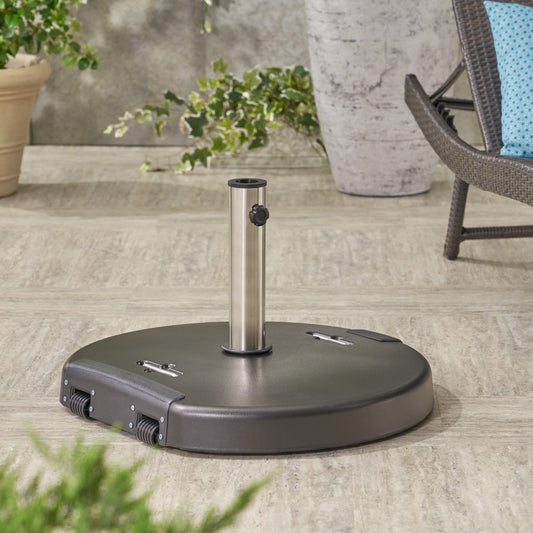 Dark grey rolling patio umbrella base with silver pole and black knob