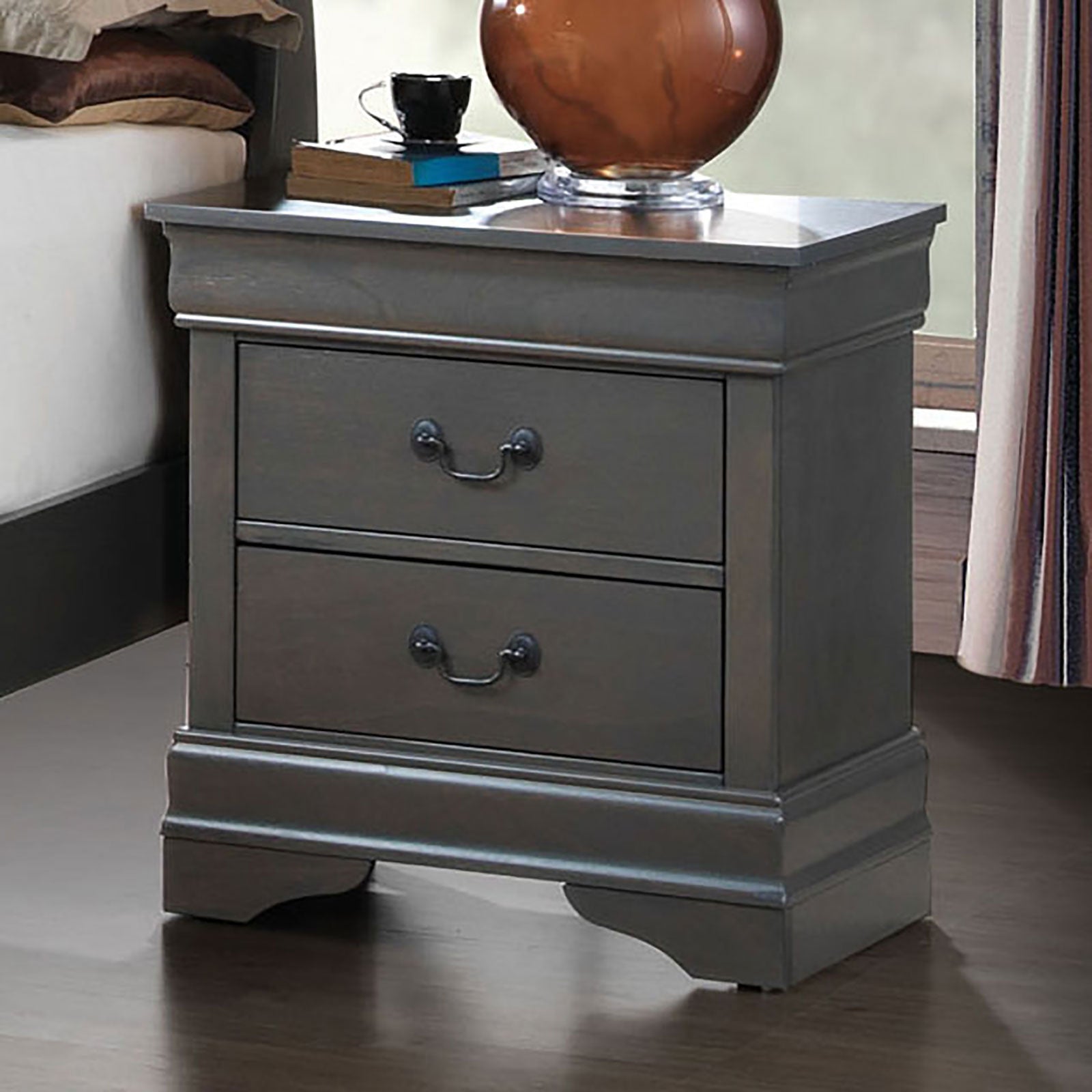 Distressed grey wooden nightstand with two drawers and ornate pull handles