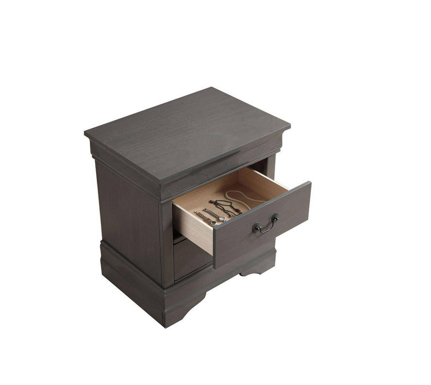 Gray wooden nightstand with one open drawer revealing jewelry