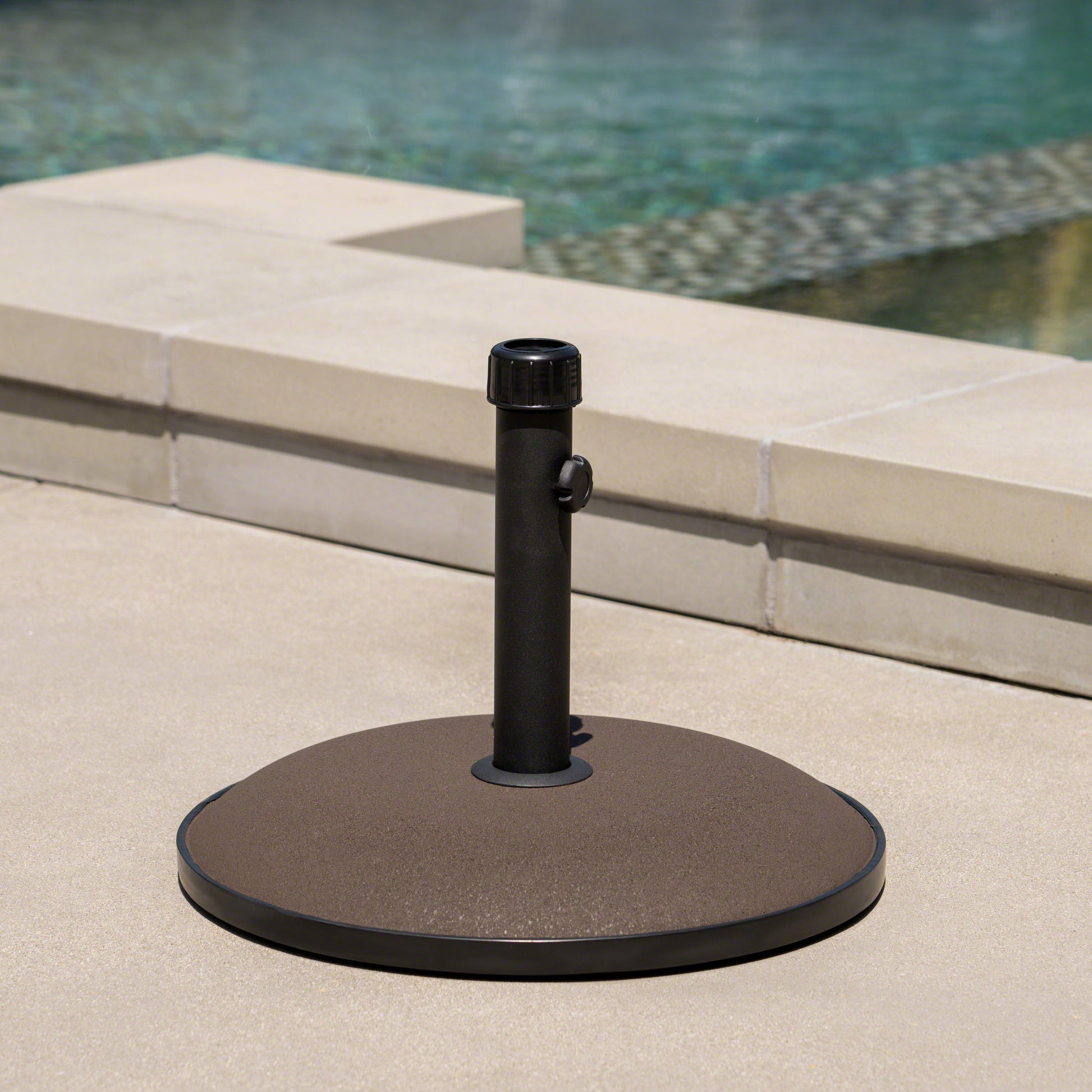 Dark grey textured base umbrella stand with black upright pole perfect for patio use