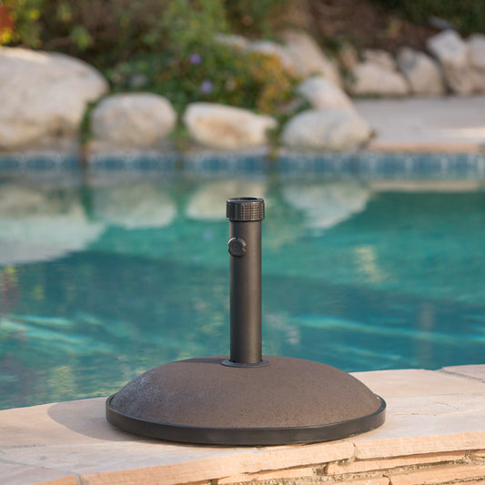Dark gray textured umbrella base with a central pole for patio shade