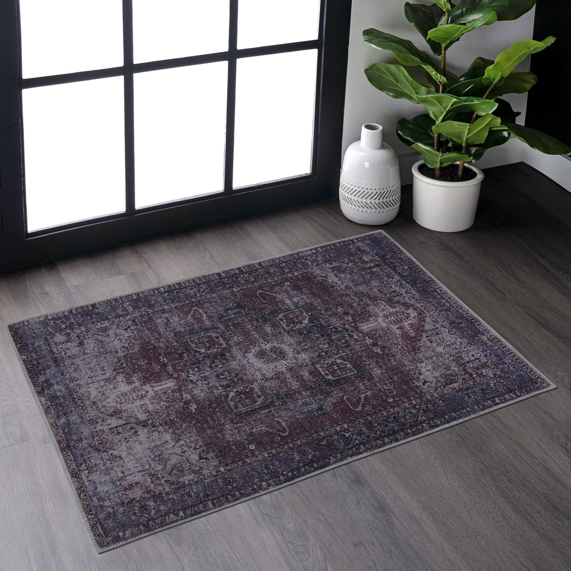 Distressed vintage area rug with floral medallion pattern in deep burgundy and grey