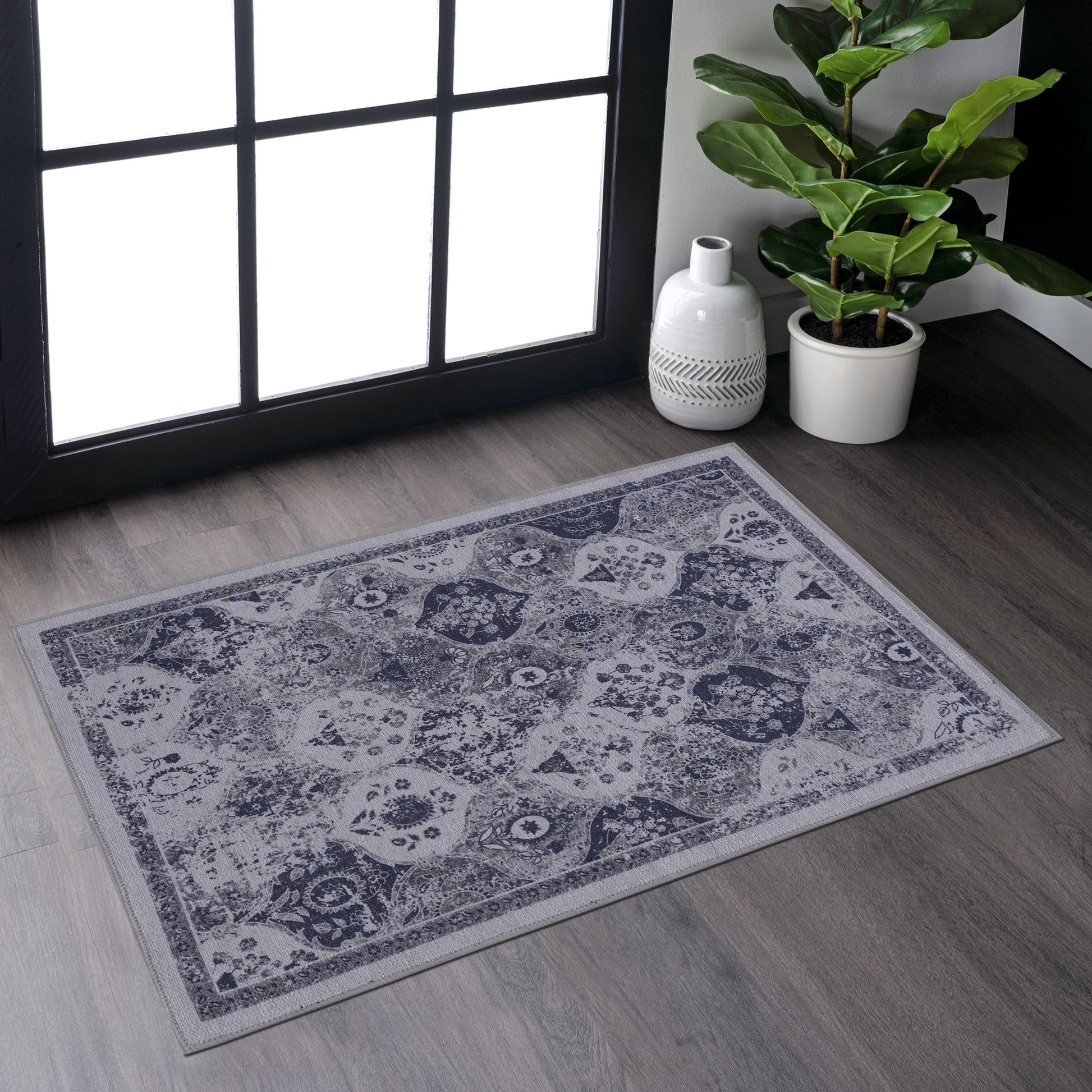 Distressed navy and grey persian runner rug with ornate medallion pattern
