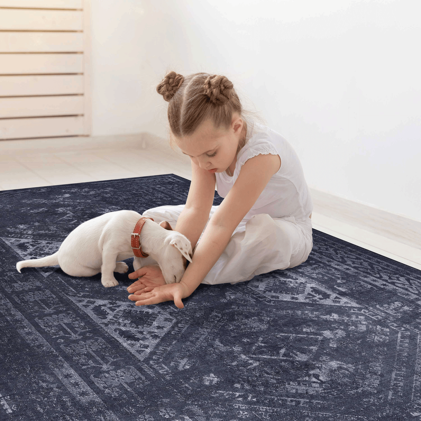Vintage navy blue area rug with distressed geometric pattern and soft texture