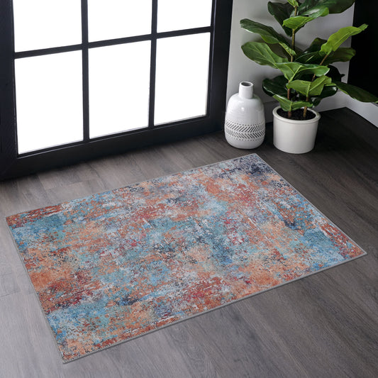 Distressed abstract area rug with blue orange and gray tones