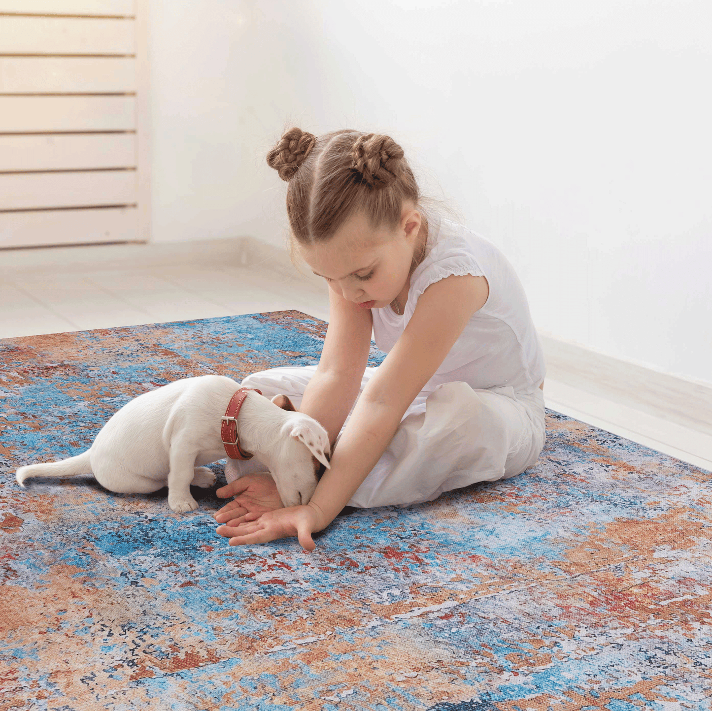 Distressed abstract area rug with blue orange and red hues