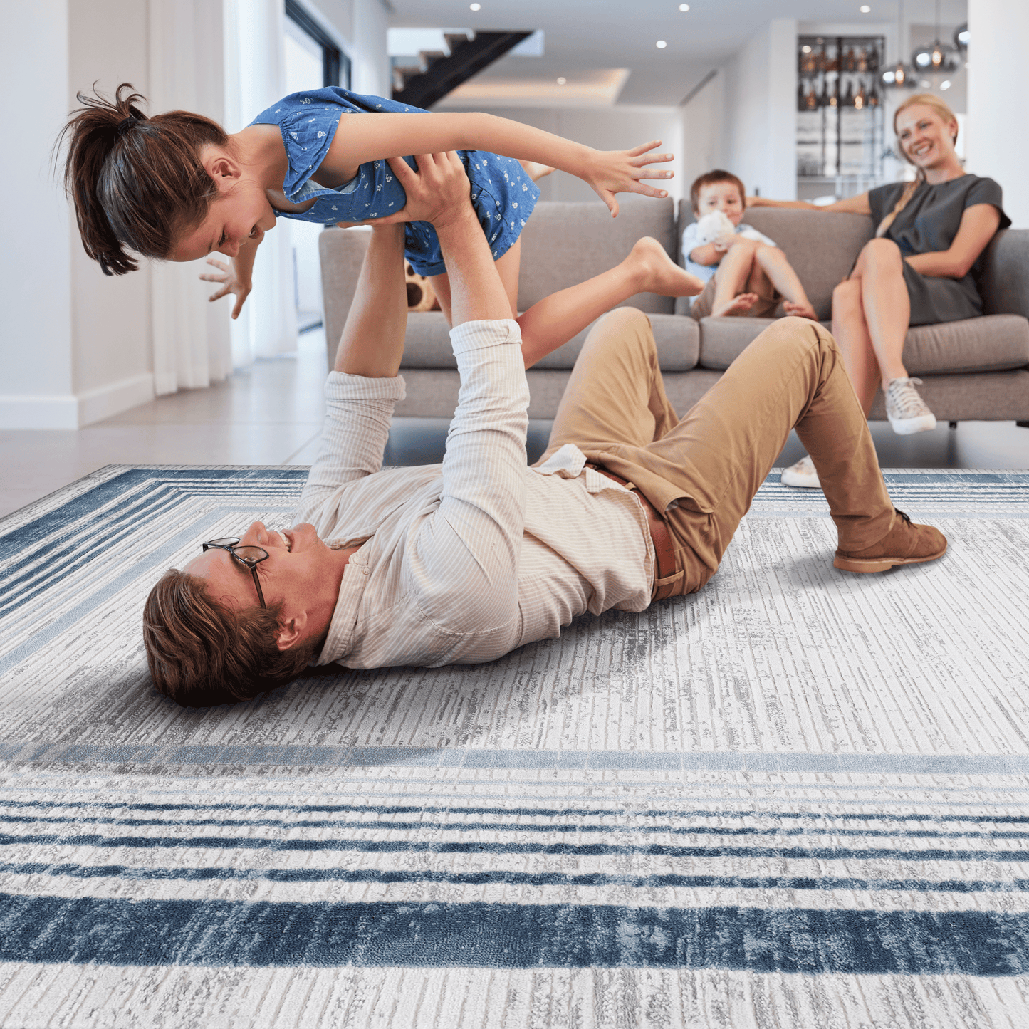 Blue and white striped area rug with textured details perfect for modern living rooms