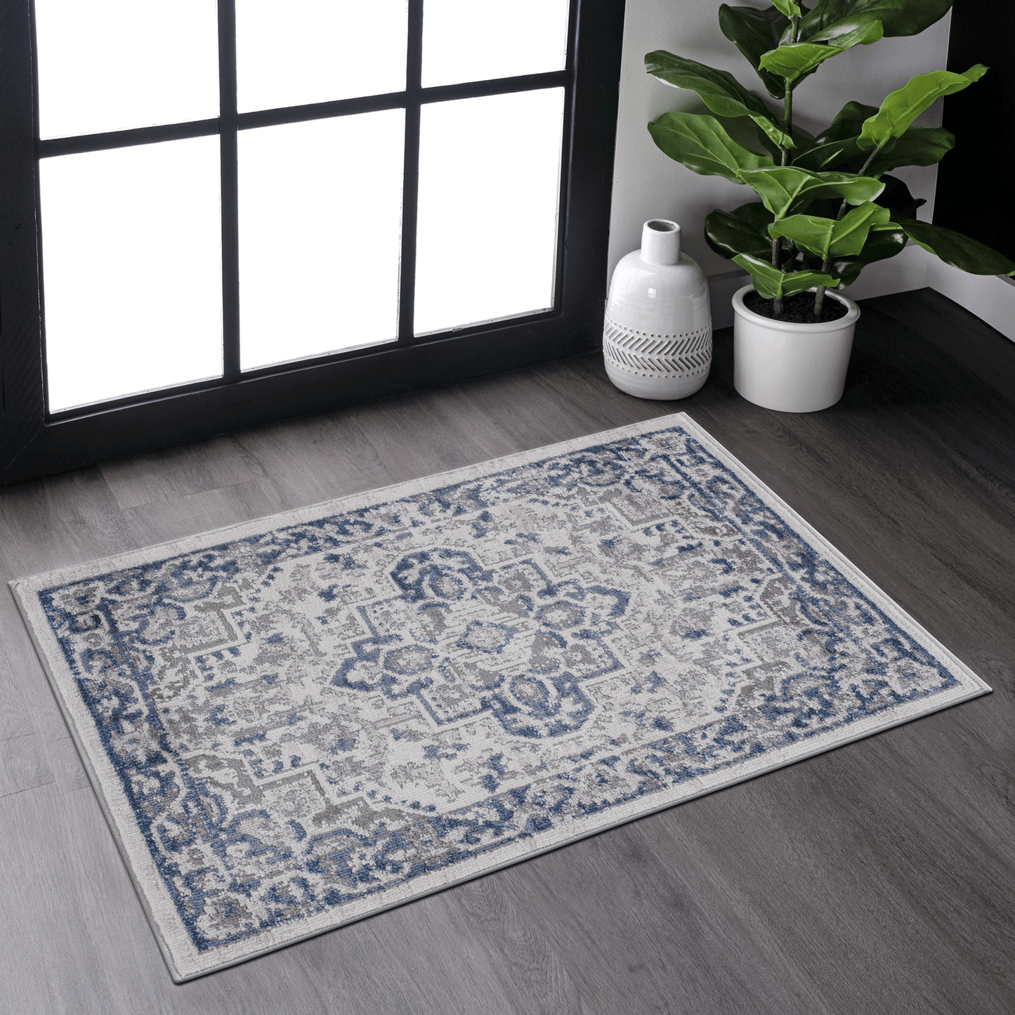 Blue and grey distressed oriental area rug with intricate damask pattern