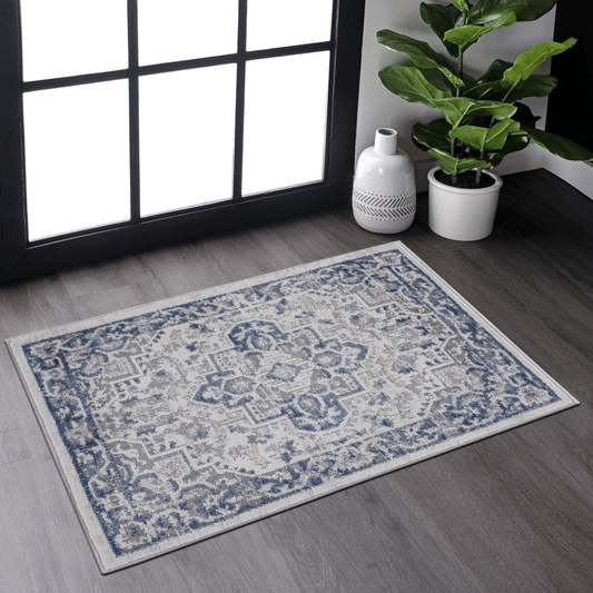 Blue and grey distressed oriental area rug with intricate damask pattern