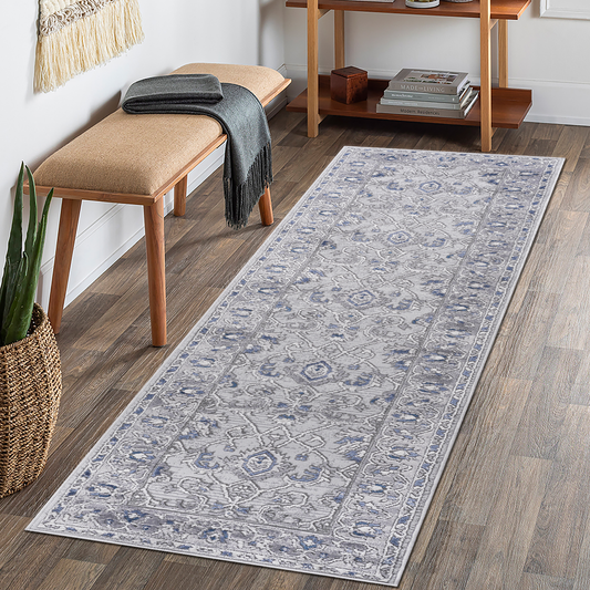 Light gray and blue distressed Persian runner rug with intricate floral pattern