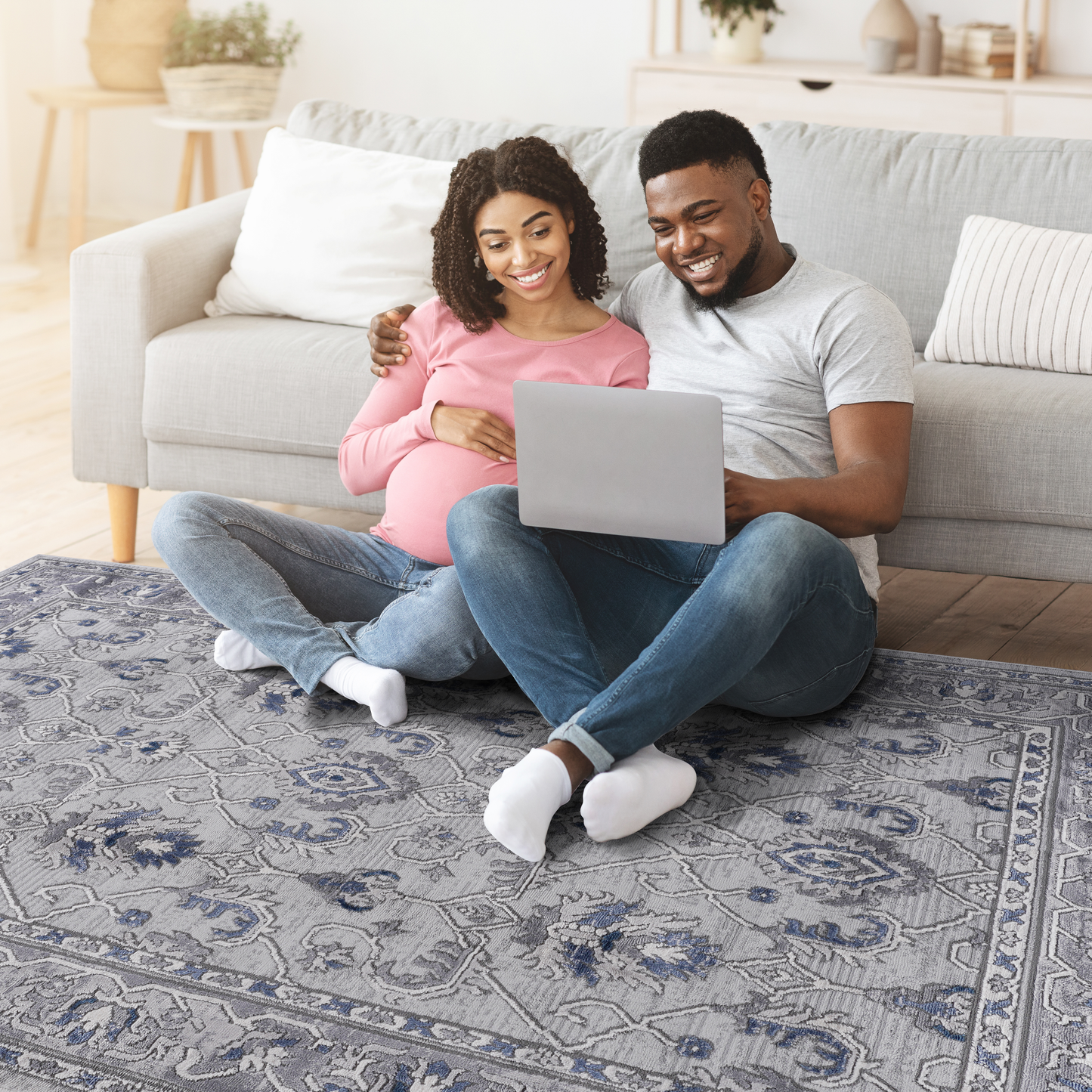 Grey persian rug with blue floral pattern and distressed finish for living room