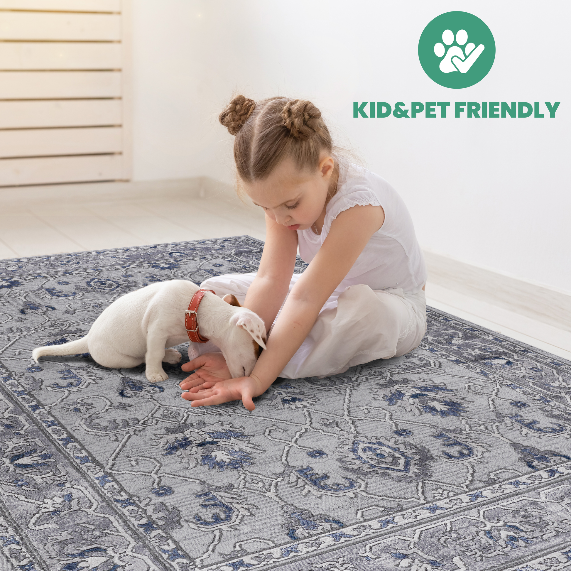 Grey Persian style rug with intricate blue floral patterns featuring a child and puppy