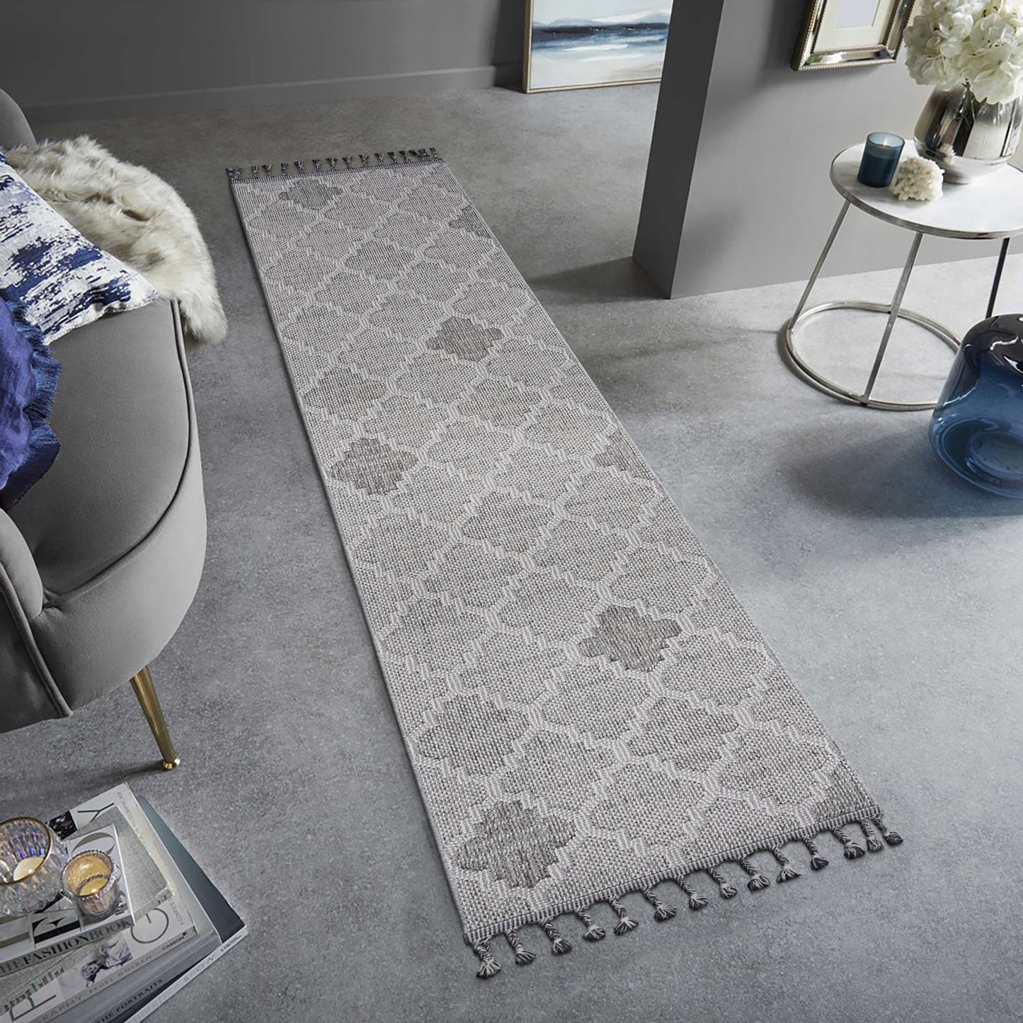 Light grey geometric patterned hallway runner rug with tassels
