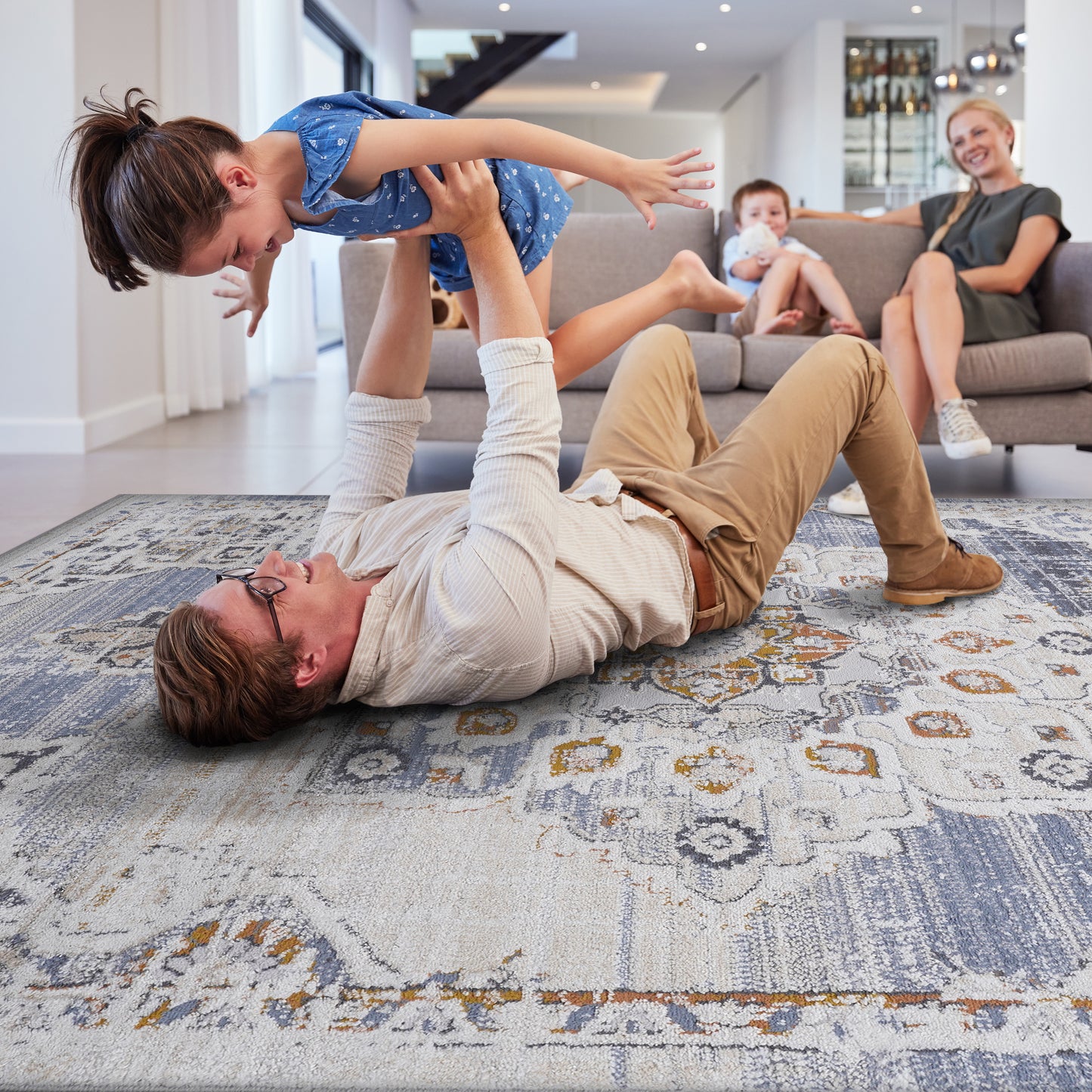 Distressed Persian rug with blue cream and gold intricate patterns adding warmth to living spaces